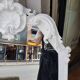 Baroque mirror in carved wood with a white patina.