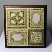Vintage ceramic and wooden trivet, circa 1960-1970.