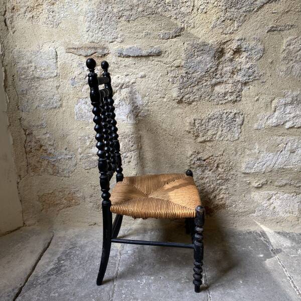 Low chair in turned wood