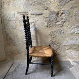 Low chair in turned wood