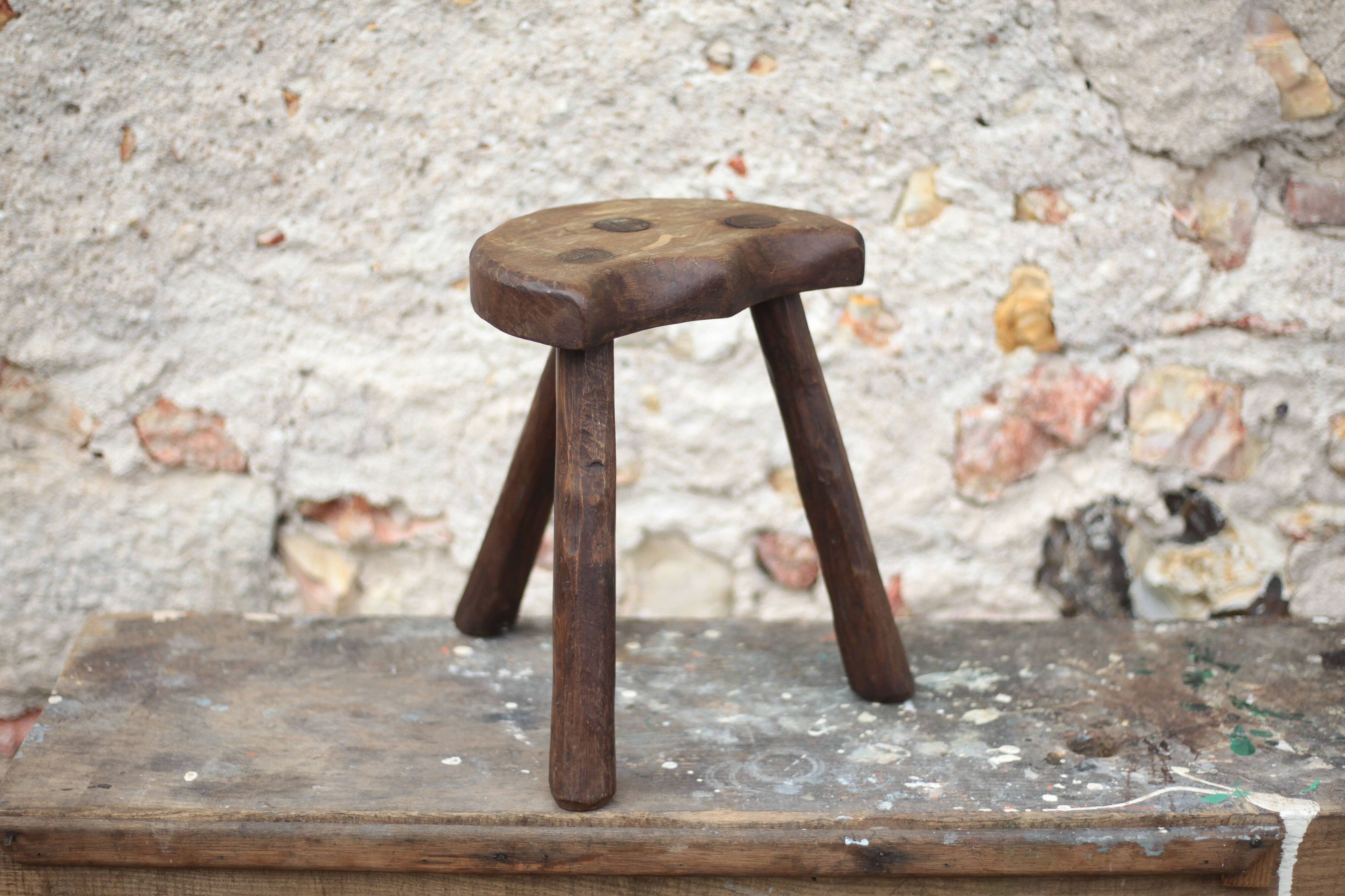 Vintage wooden tripod stool, mountain work, wabi-sabi, shepherd.