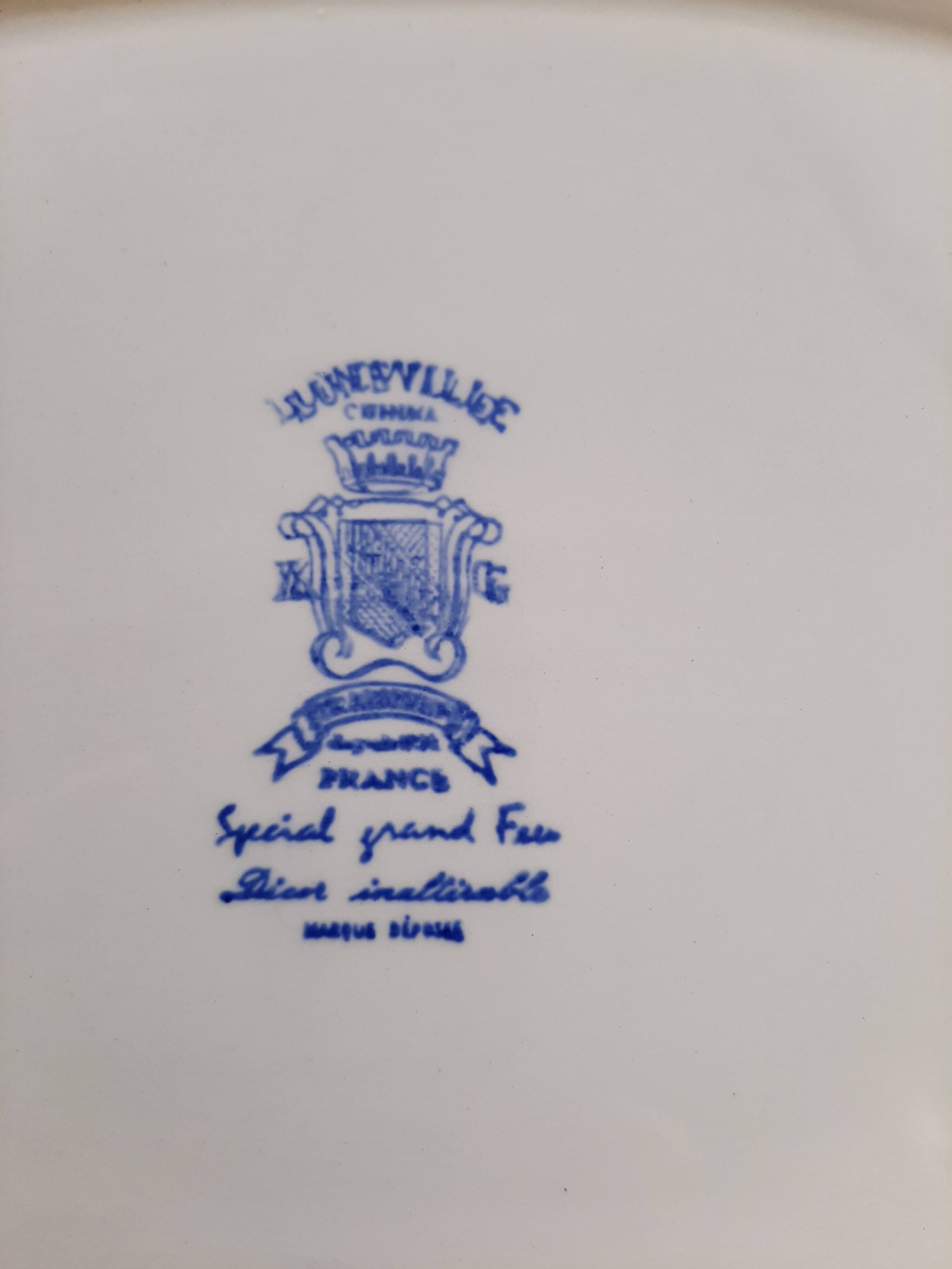 Keller and Guérin Lunéville serving dish with blue flowers on a white background.
