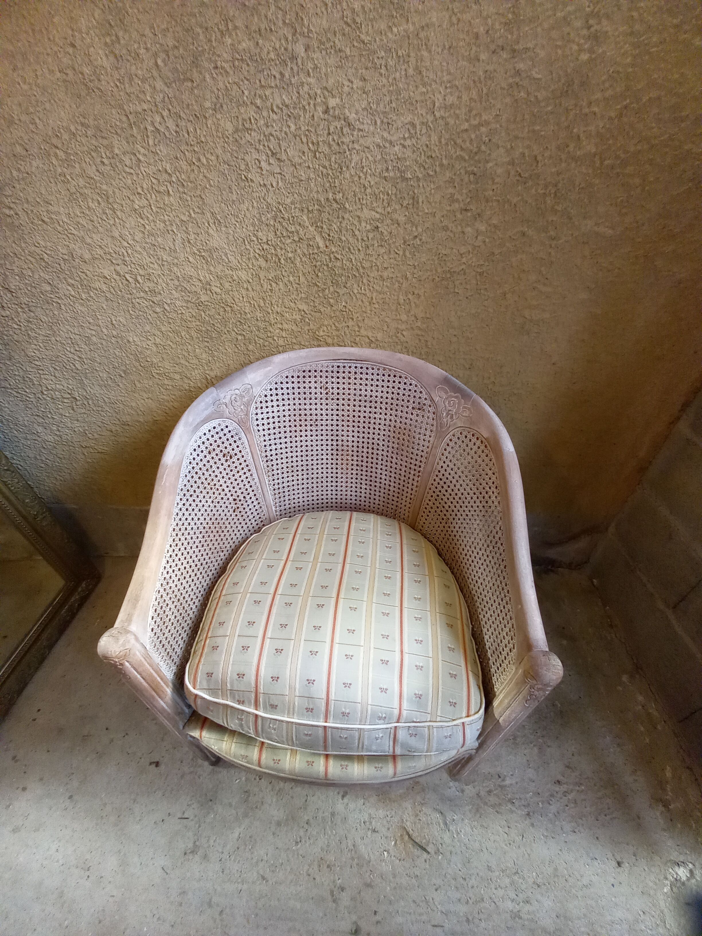 Canned basket armchair