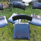 4 Chairs with chrome tubular metal base and black Skaï