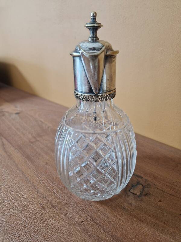 Cut crystal carafe and silver-plated metal