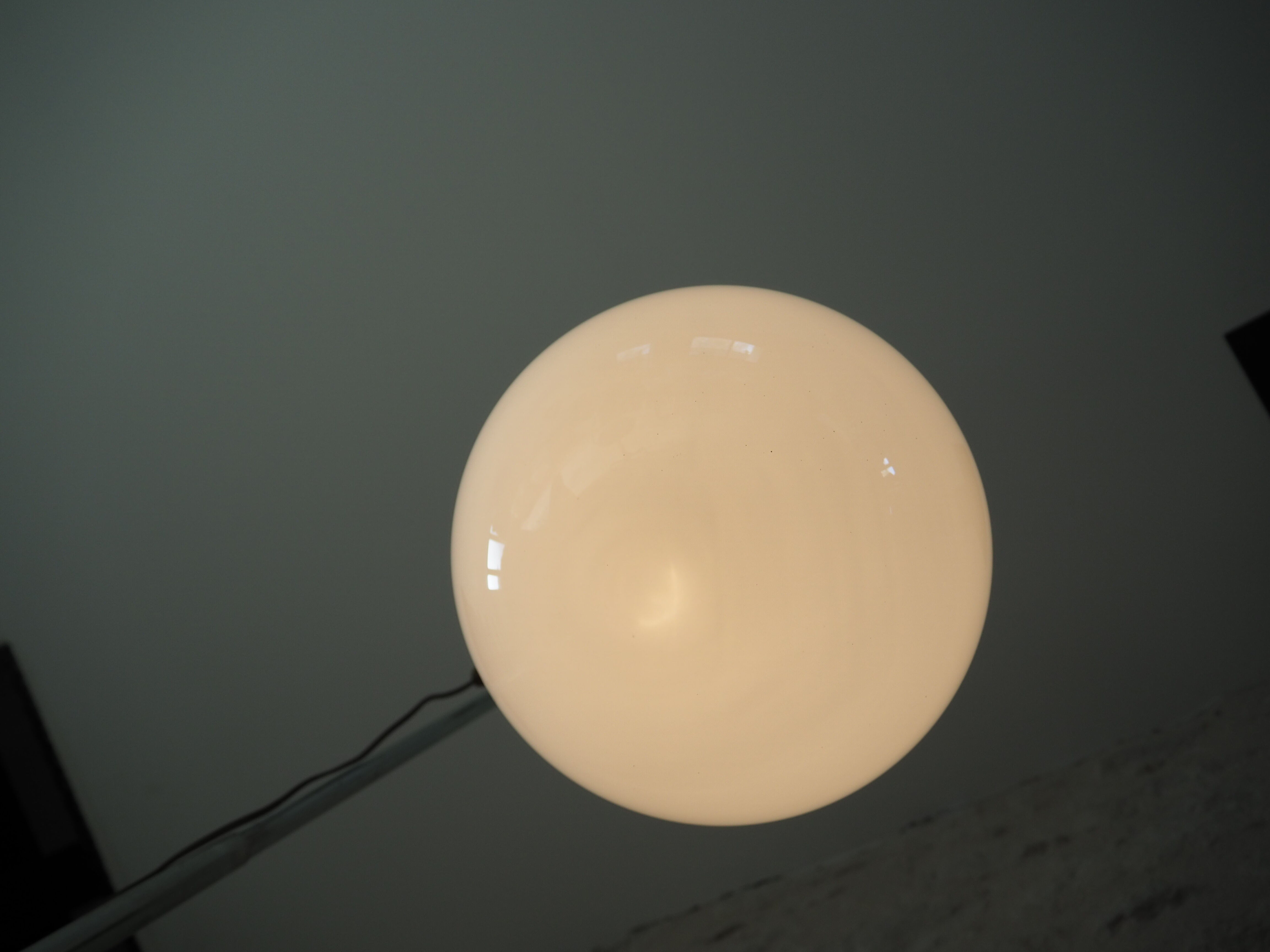 Art deco globe pendant light in white opaline and aluminum rod