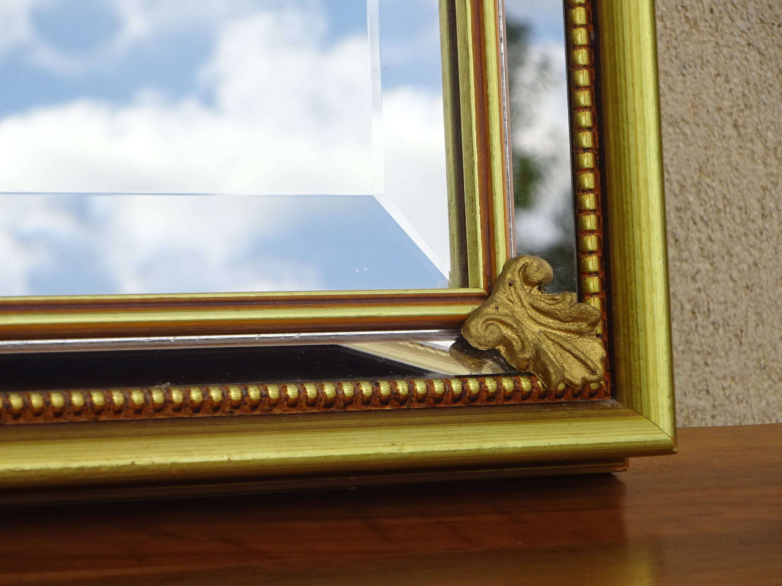 Hallway mirror, gilded frame, curtains and fleur-de-lis