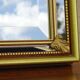Hallway mirror, gilded frame, curtains and fleur-de-lis