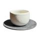 White Indonesian ceramic cup and gray saucer