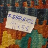 Afghan kilim rug in multicolored wool, geometric patterns