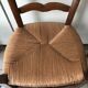 Wooden and straw chairs