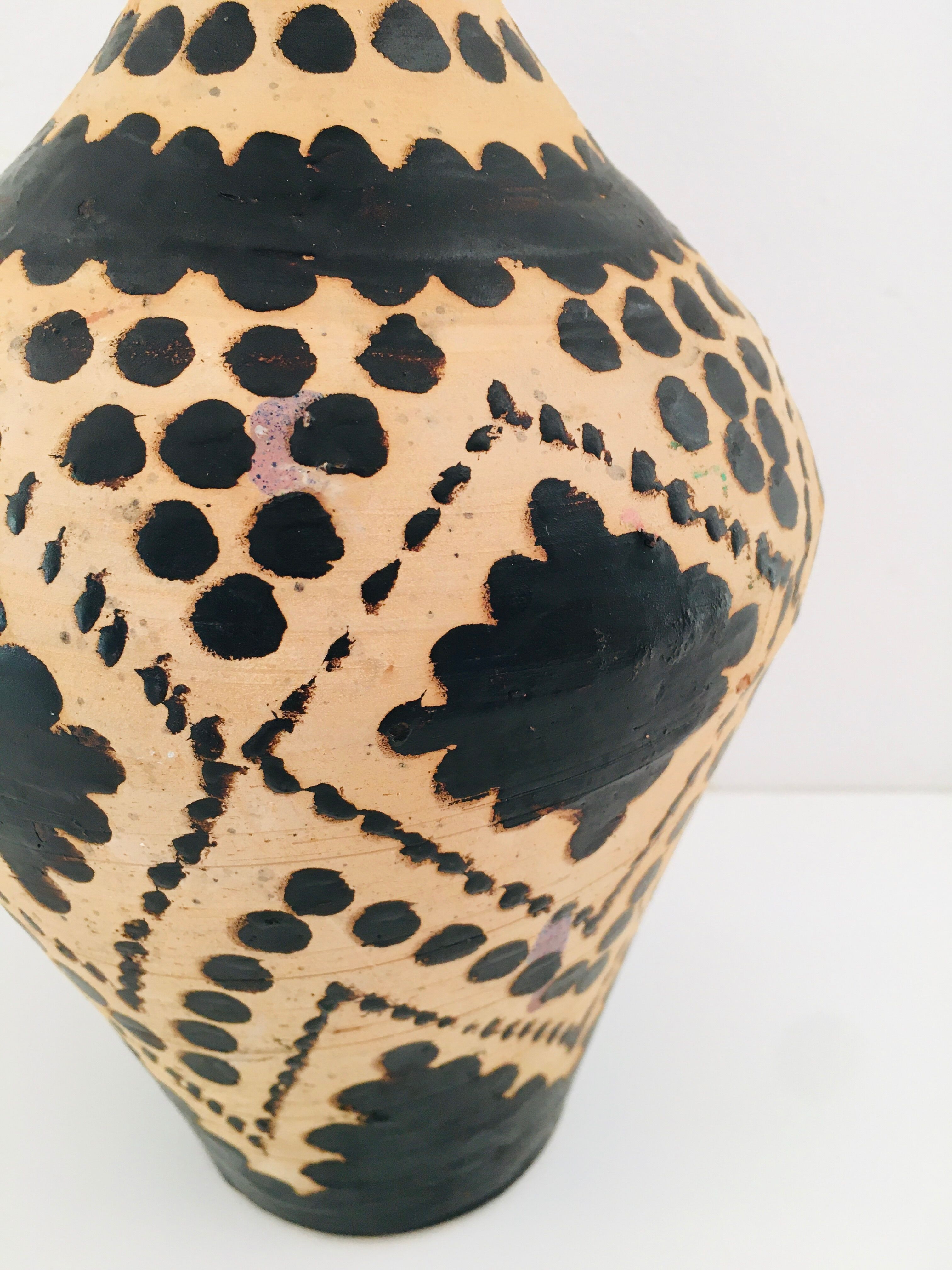 Raw and black terracotta jug