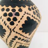 Raw and black terracotta jug