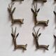 12 bronze and brass knife rests, African art, gazelles