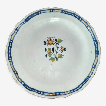 Old earthenware plate of the North XVIIIth Century with floral decoration