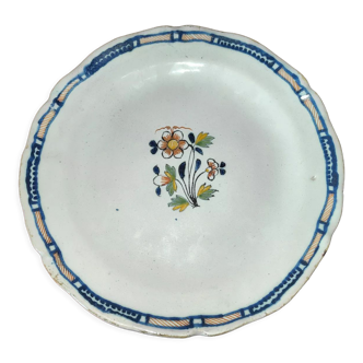 Old earthenware plate of the North XVIIIth Century with floral decoration