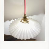 Pleated opaline suspension