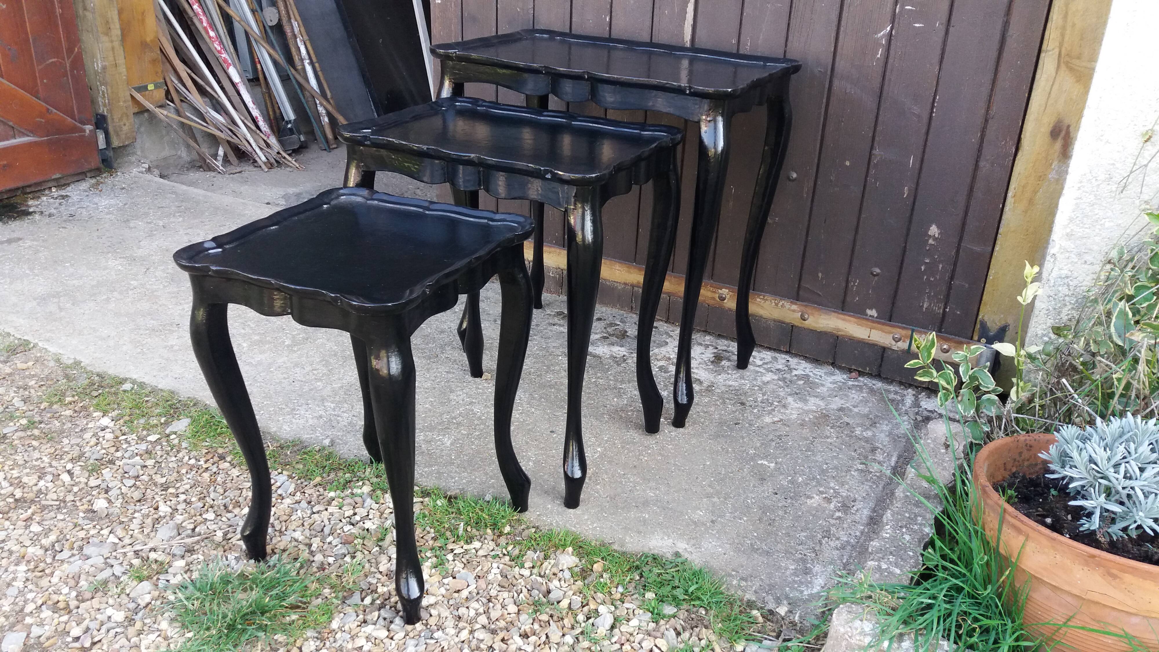 Set of 3 black nesting tables.