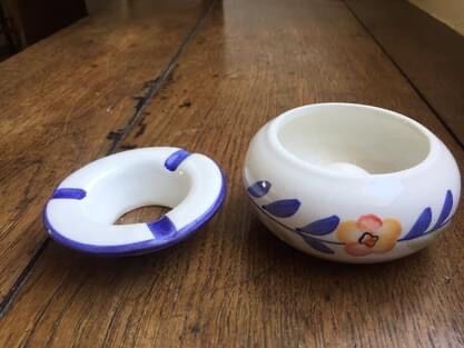 Small ceramic ashtray in two parts. Like new