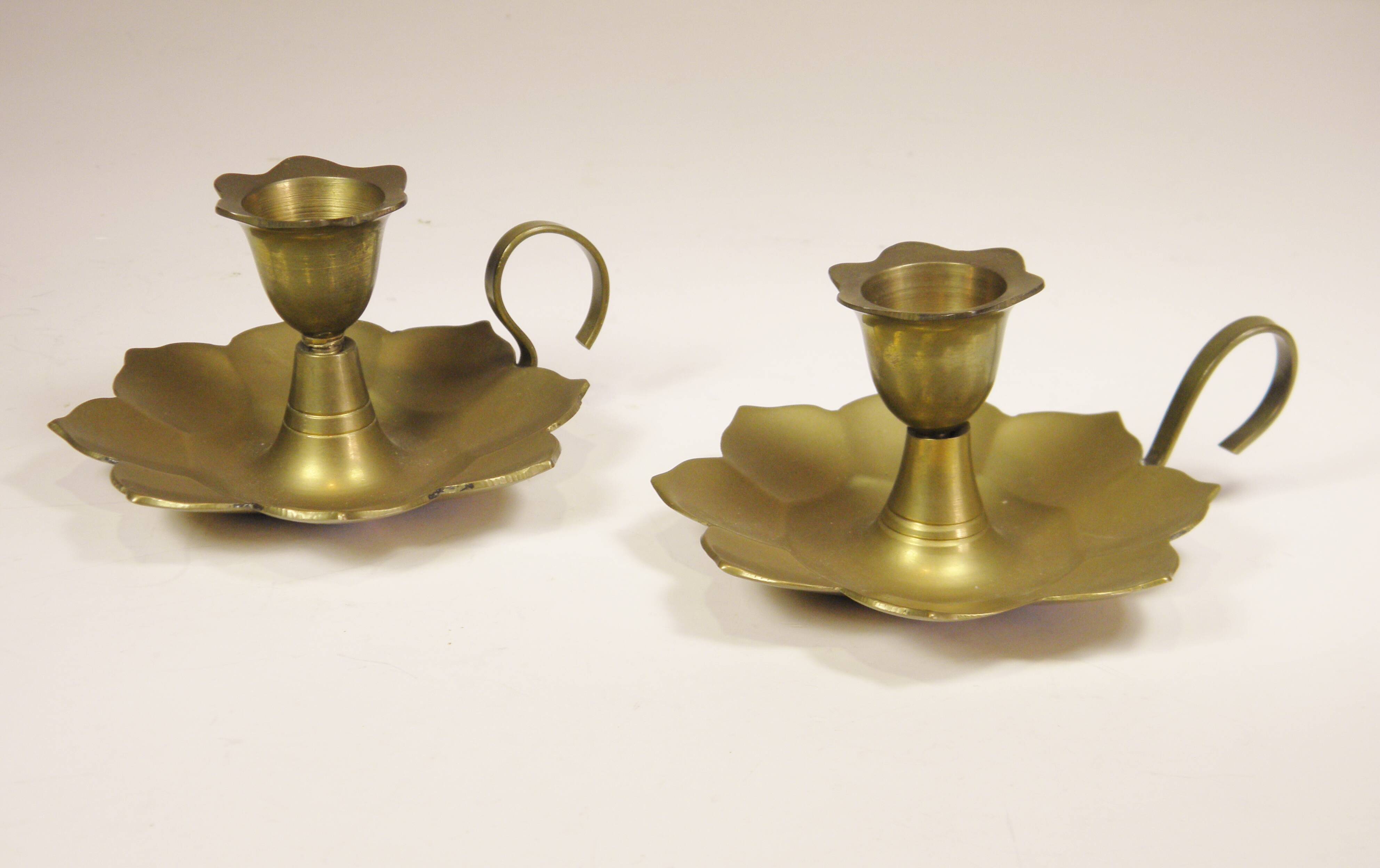 Pair of brass "flower" candlesticks