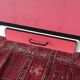 Table, chairs and kitchen furniture in red and black formica