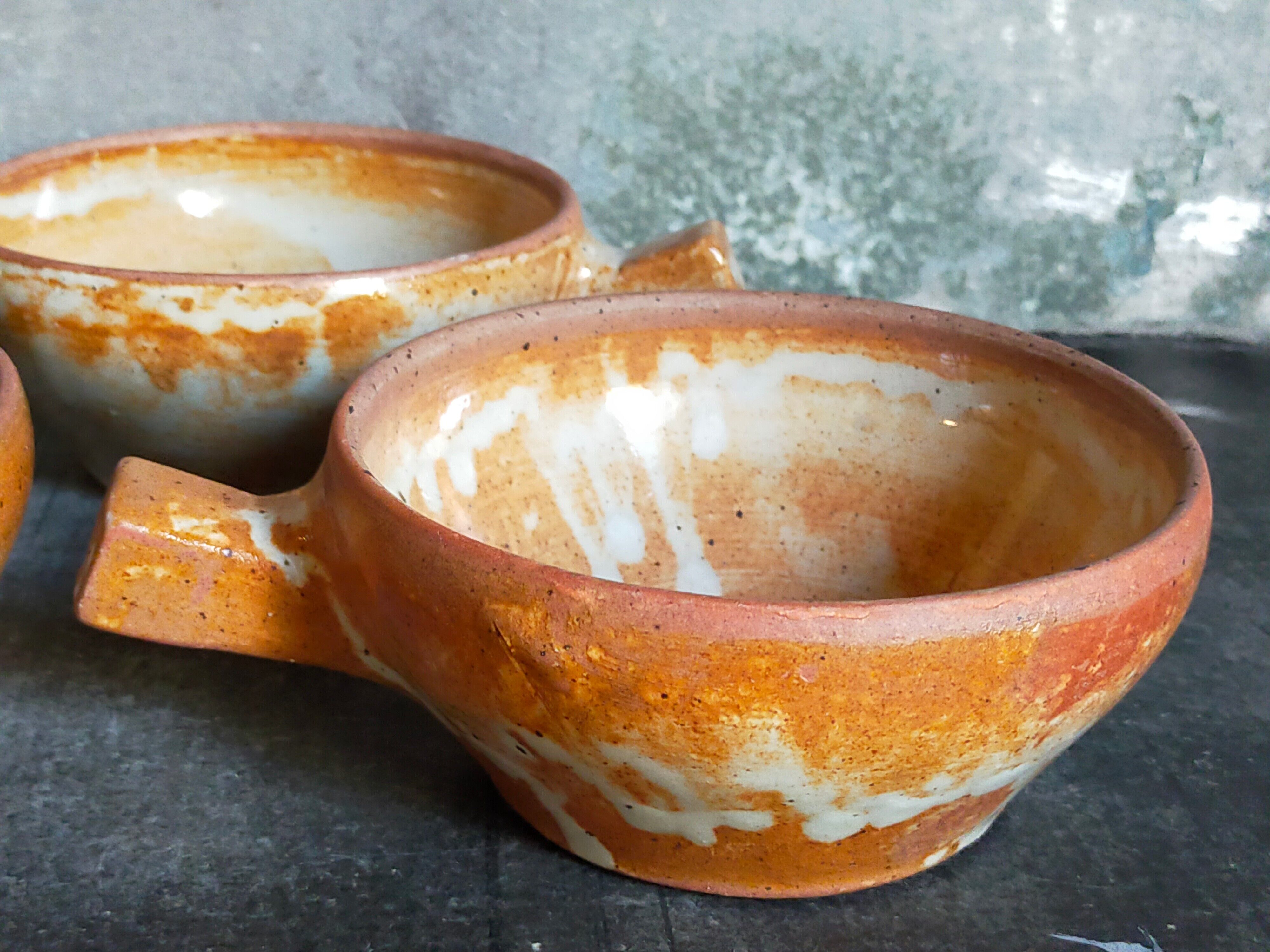 Three vintage marais sandstone bowls