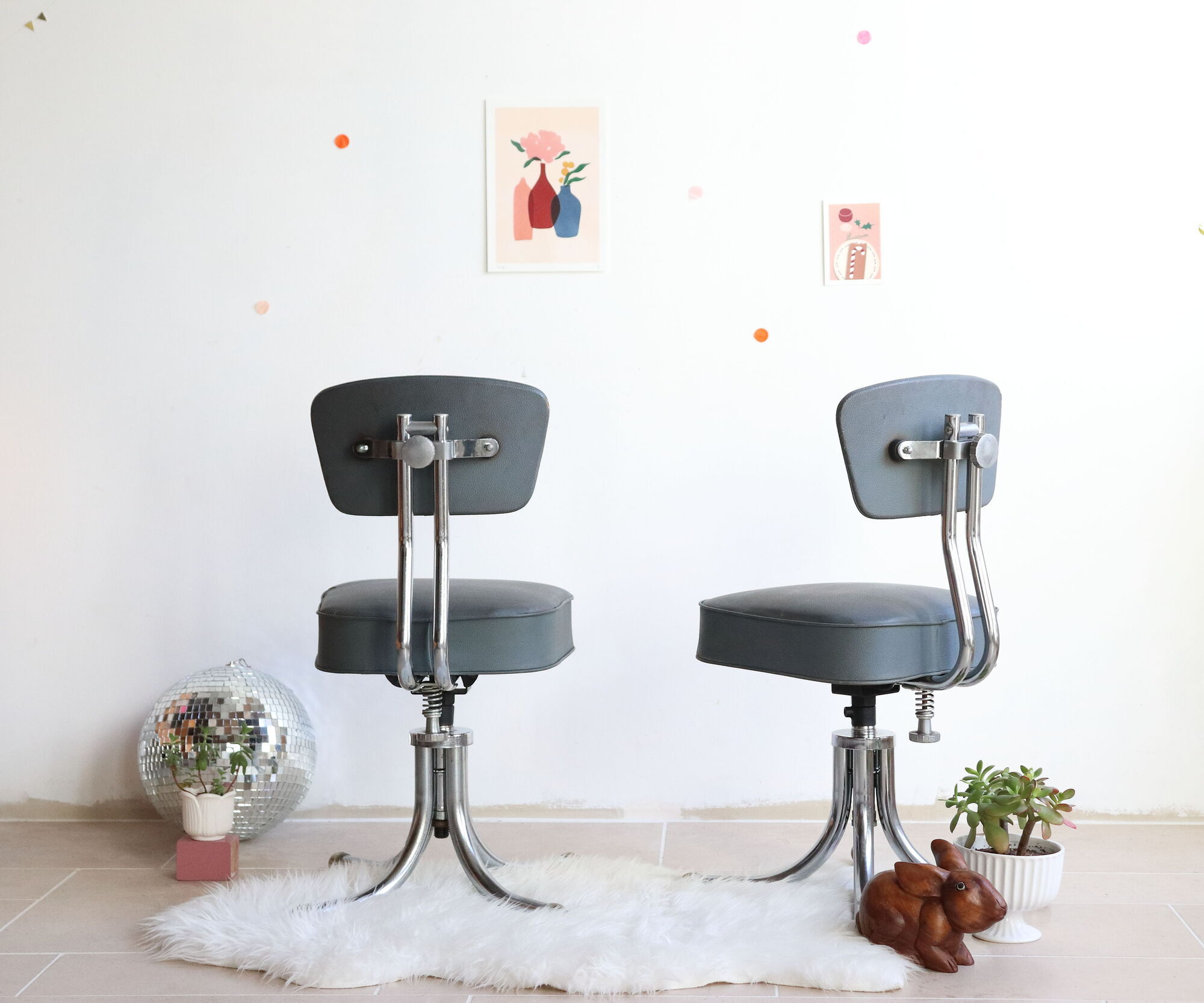 Pair of workshop chairs from the 50s in chrome steel and imitation leather
