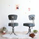 Pair of workshop chairs from the 50s in chrome steel and imitation leather