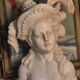 Bust of a woman with a hat