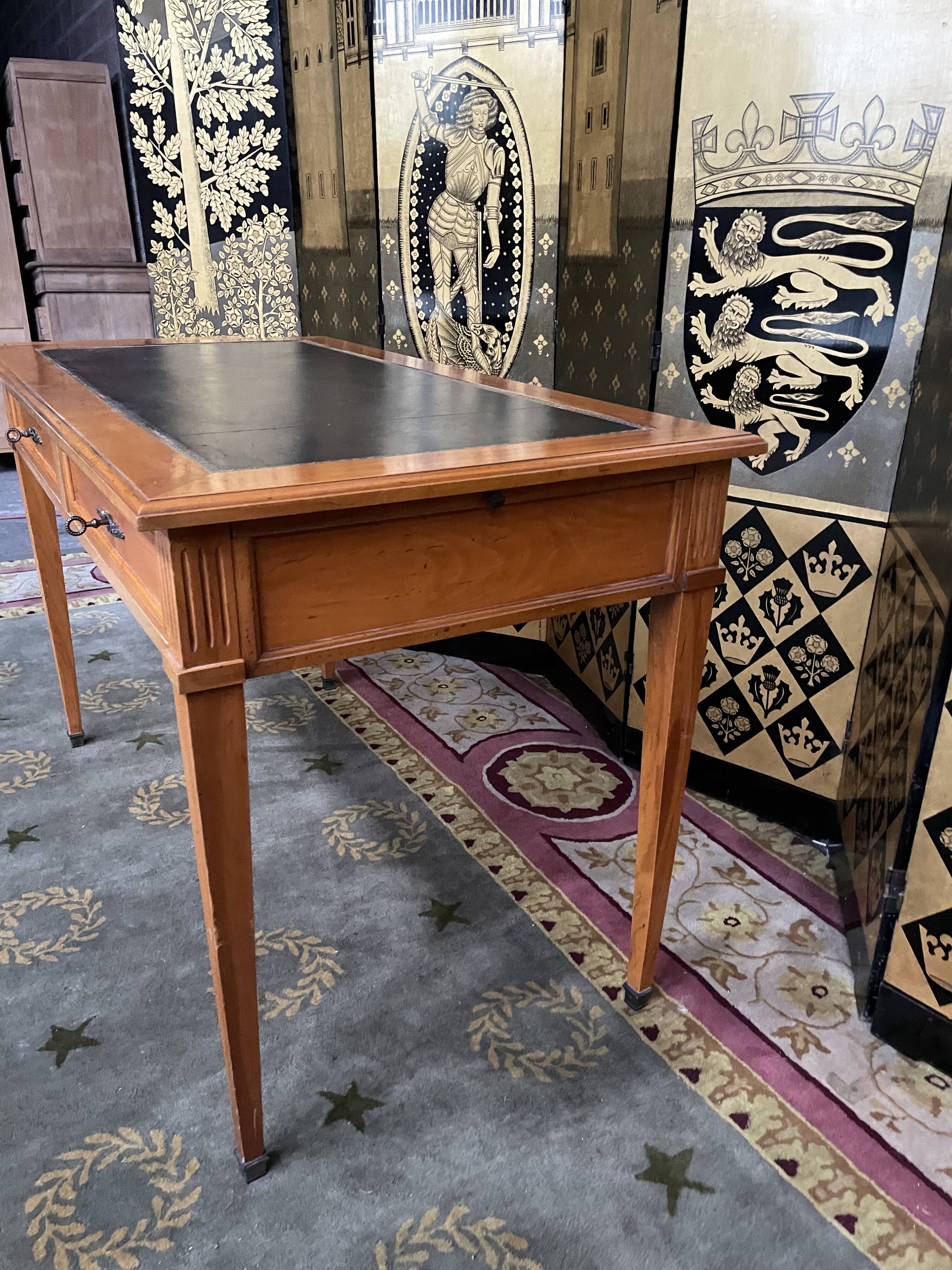 Desk full of Louis XVI style black leather