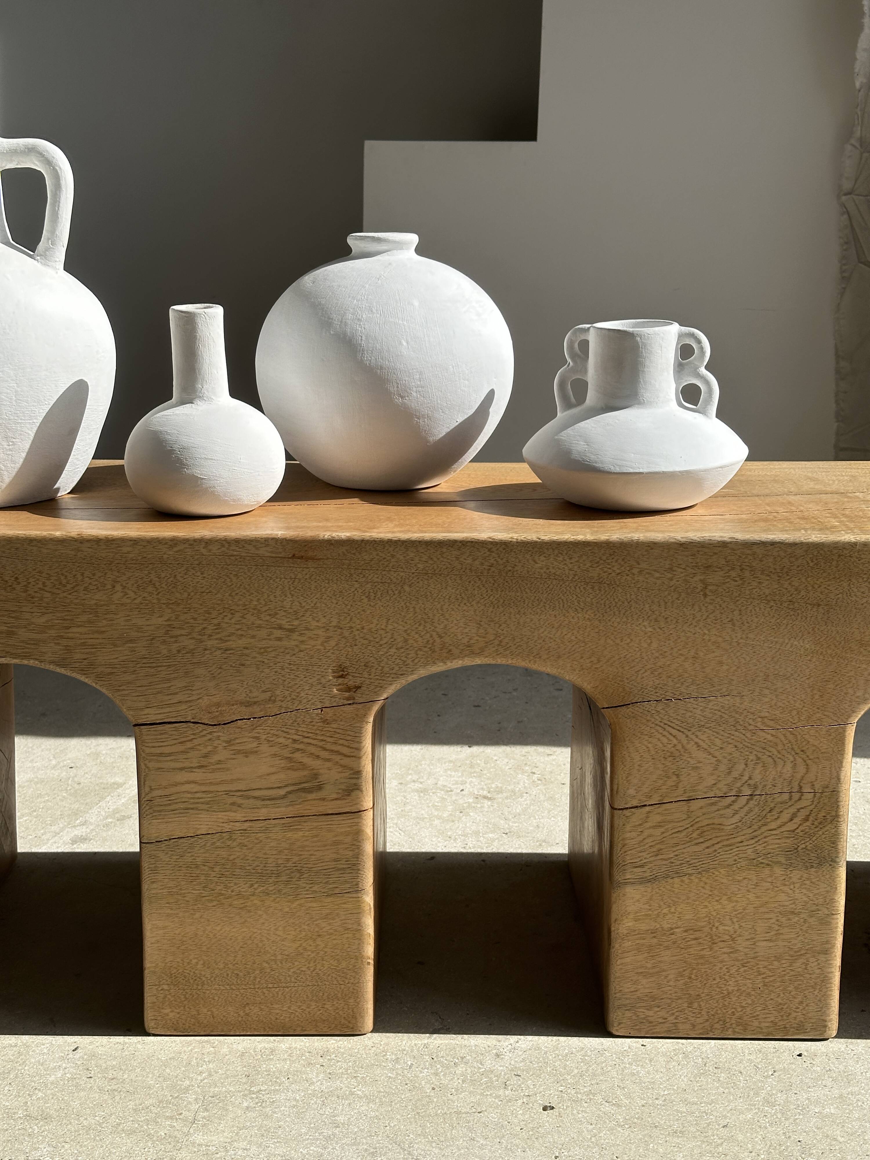 Solid monoxyl wood bench with carved 3-arch base - Natural wood color