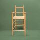 Old wooden and straw high chair for children