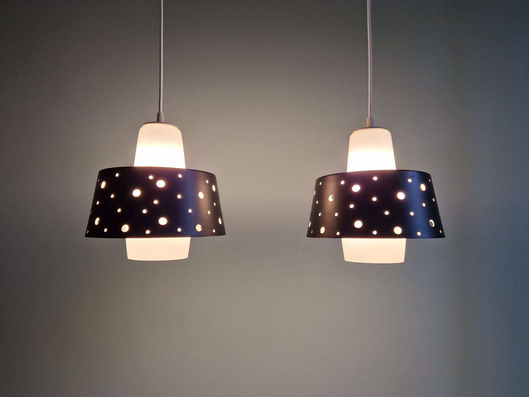 A pair of Scandinavian pendant lights in white opaline and black lacquered metal, 1960.