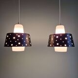 A pair of Scandinavian pendant lights in white opaline and black lacquered metal, 1960.