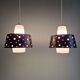A pair of Scandinavian pendant lights in white opaline and black lacquered metal, 1960.