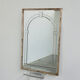 Large Art Deco style beveled wall mirror with architectural arch design