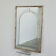 Large Art Deco style beveled wall mirror with architectural arch design