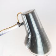 Table lamp of stainless steel and of italian design by Flos