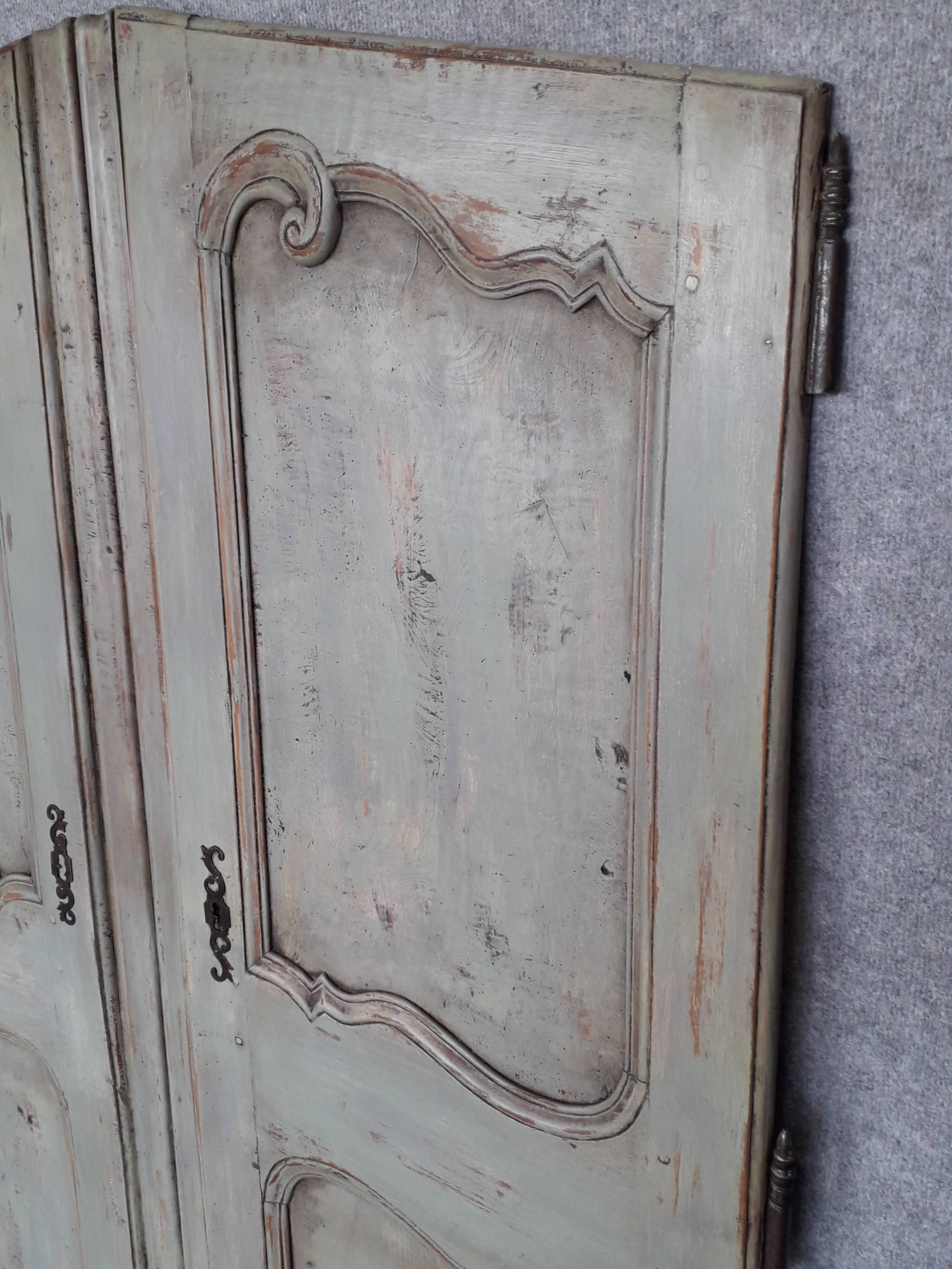 Pair of Louis XV period walnut and ash cabinet doors