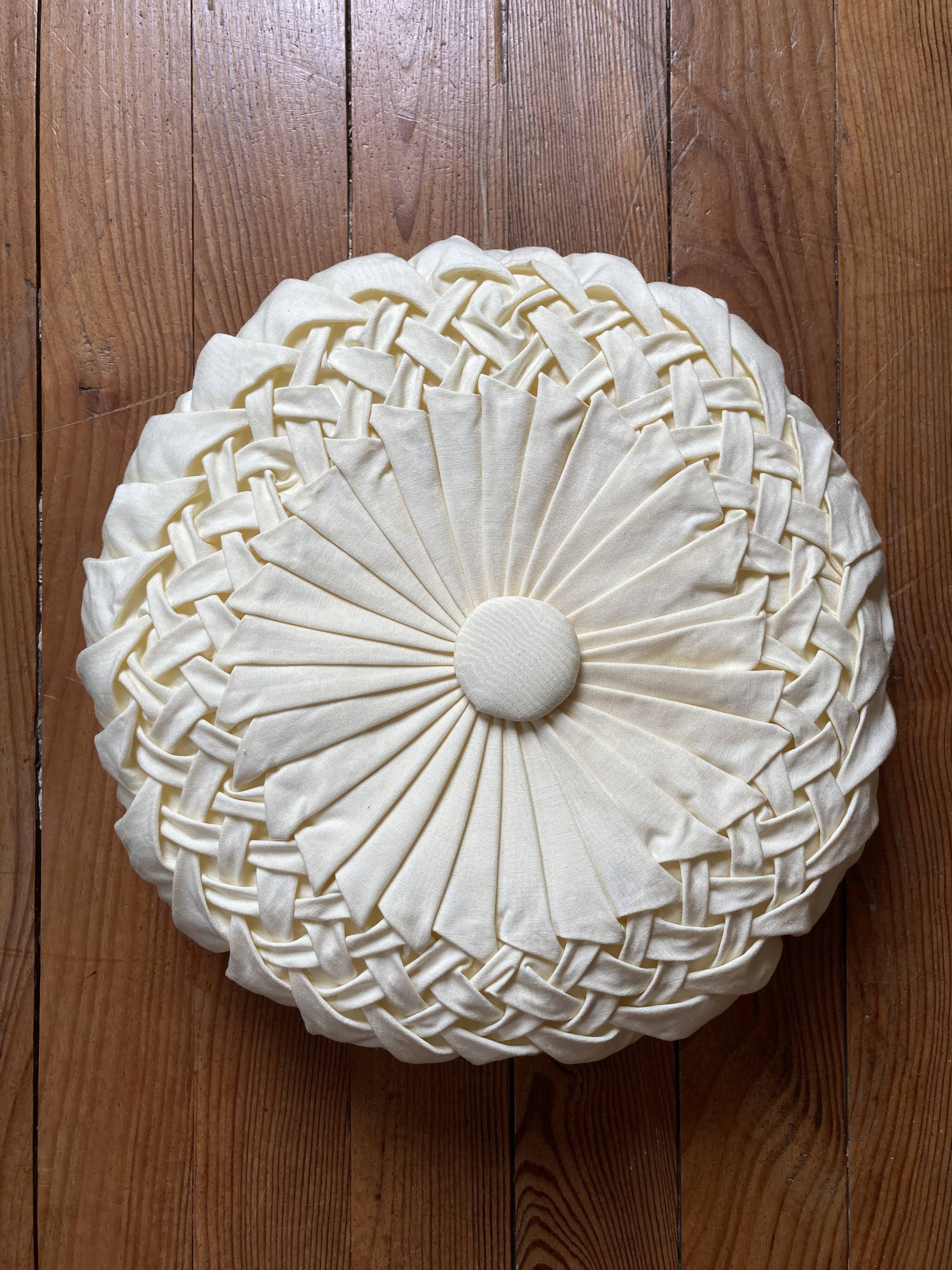 Cushion in beige fabric