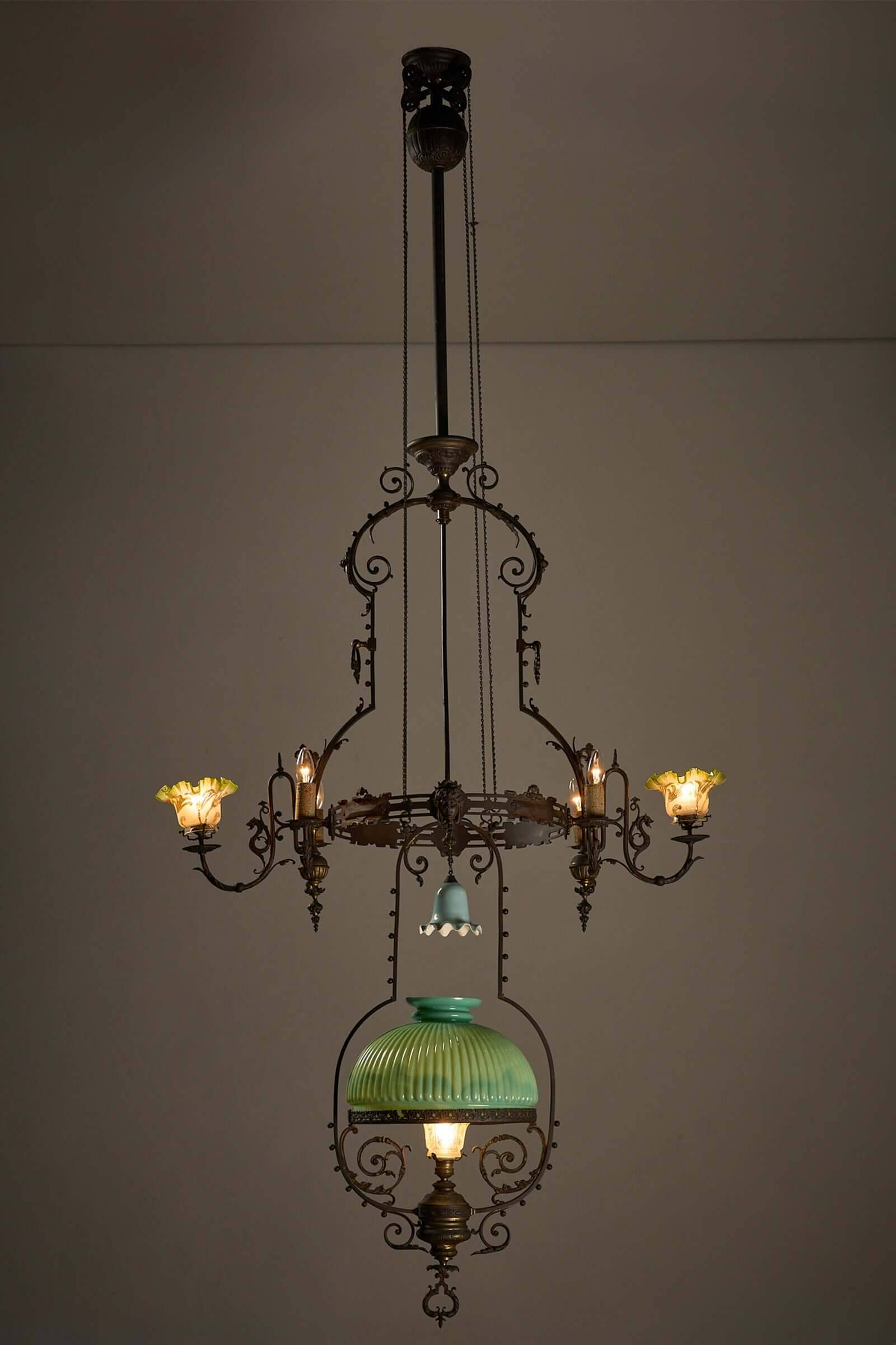Antique adjustable height chandelier with original glasswork and brass detailing