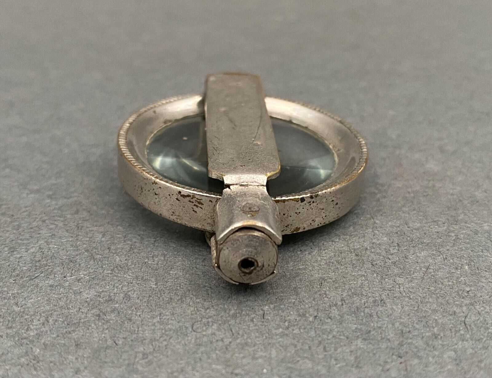 Foldable magnifying glass in silver metal 1900