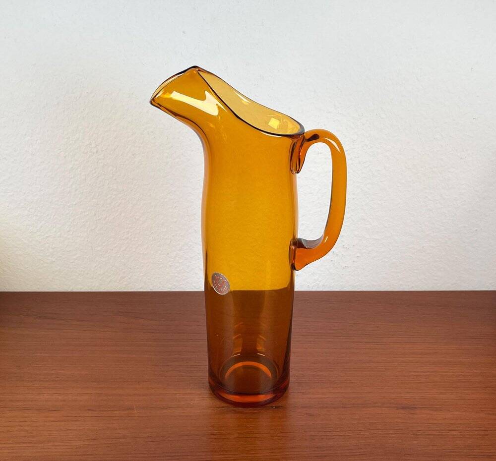 Amber glass carafe from the mid-century German Jagdhaus series and drinking glasses by Wilhelm Braun-Feldweg for Hirschberg, 1960s, set of 7.