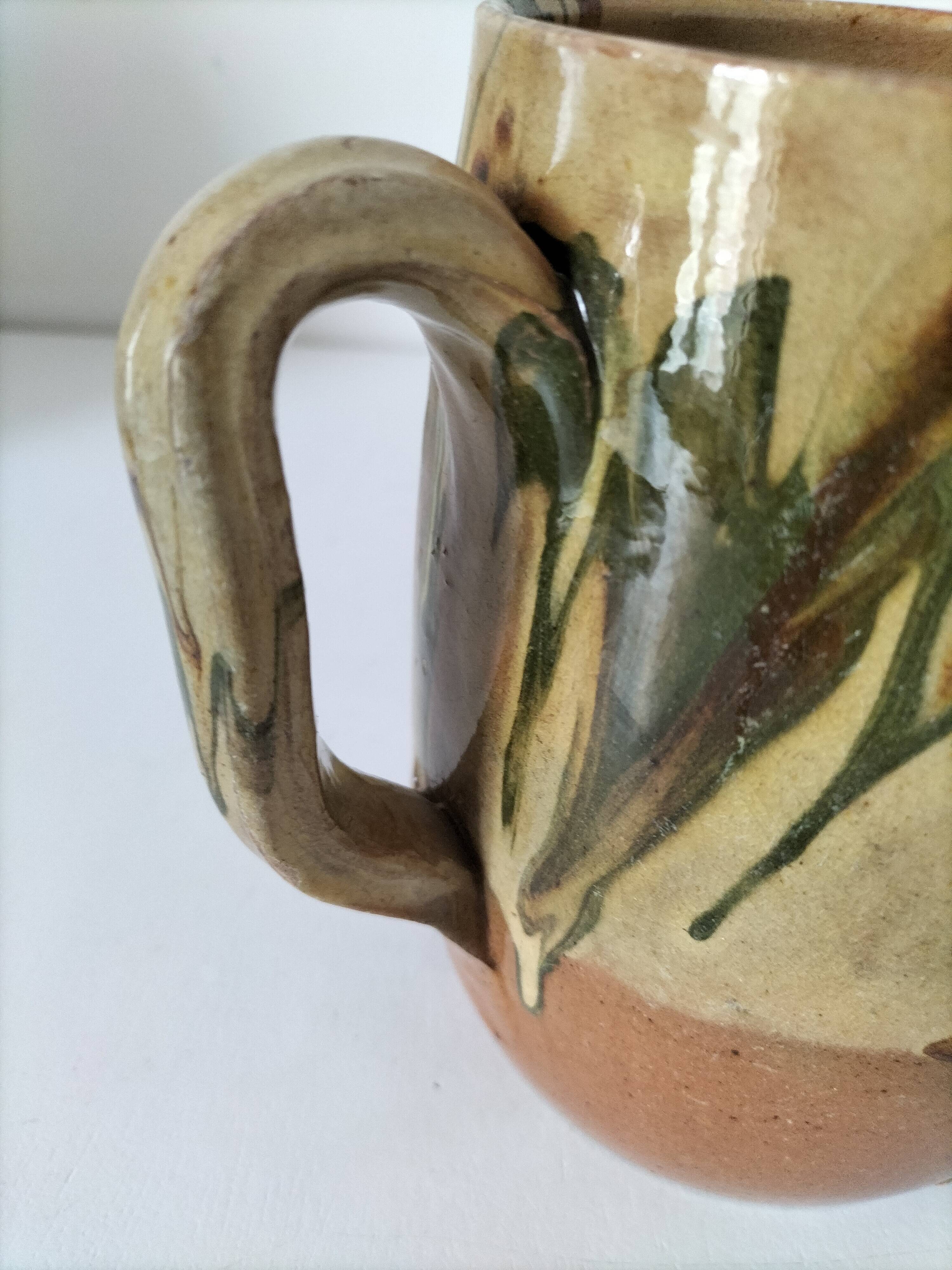 Glazed earthenware jug