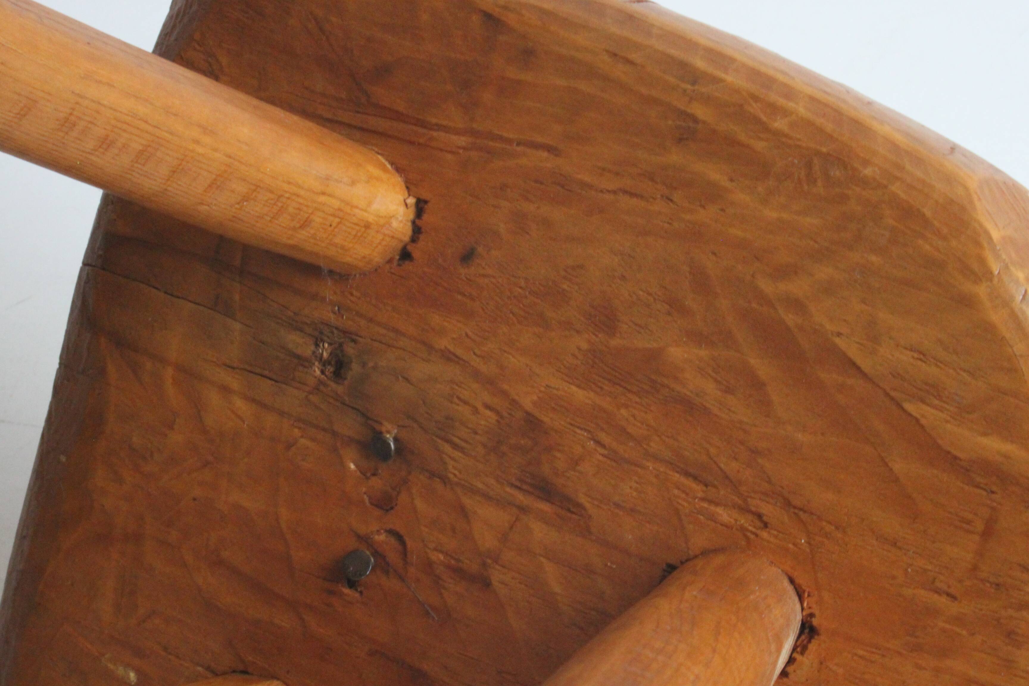 Brutalist tripod stool in carved wood, 1950s
