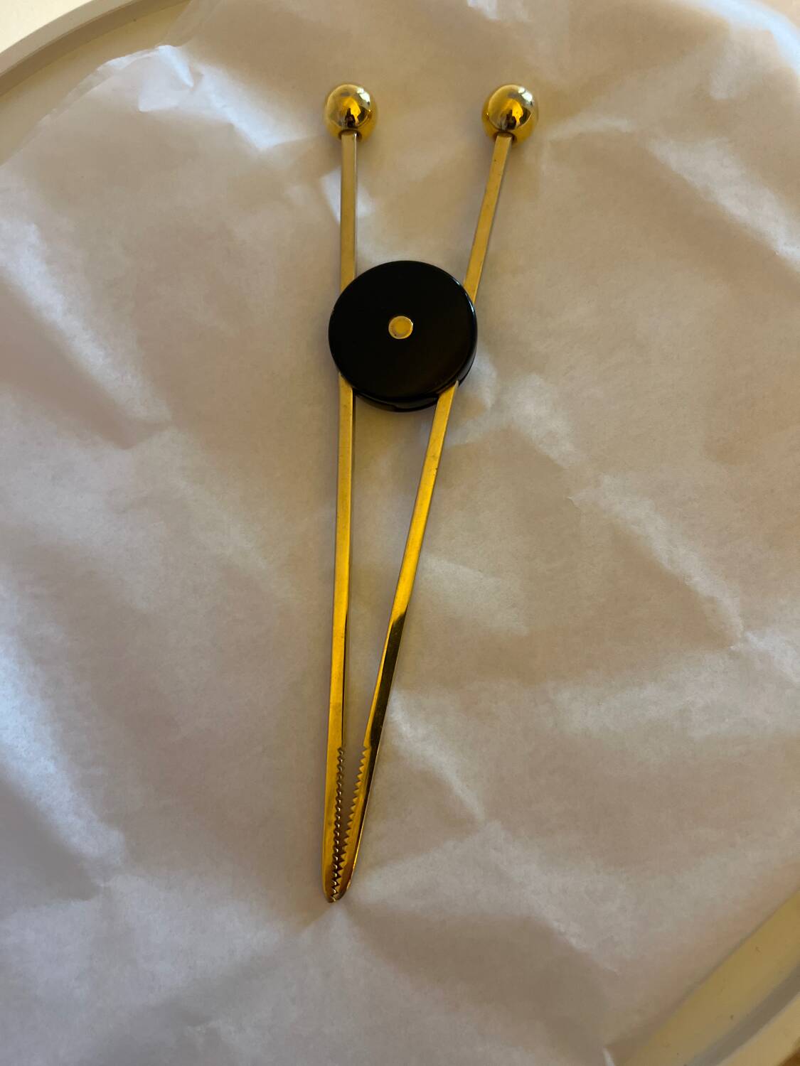 Sugar tongs. Confectionery. Ice cubes