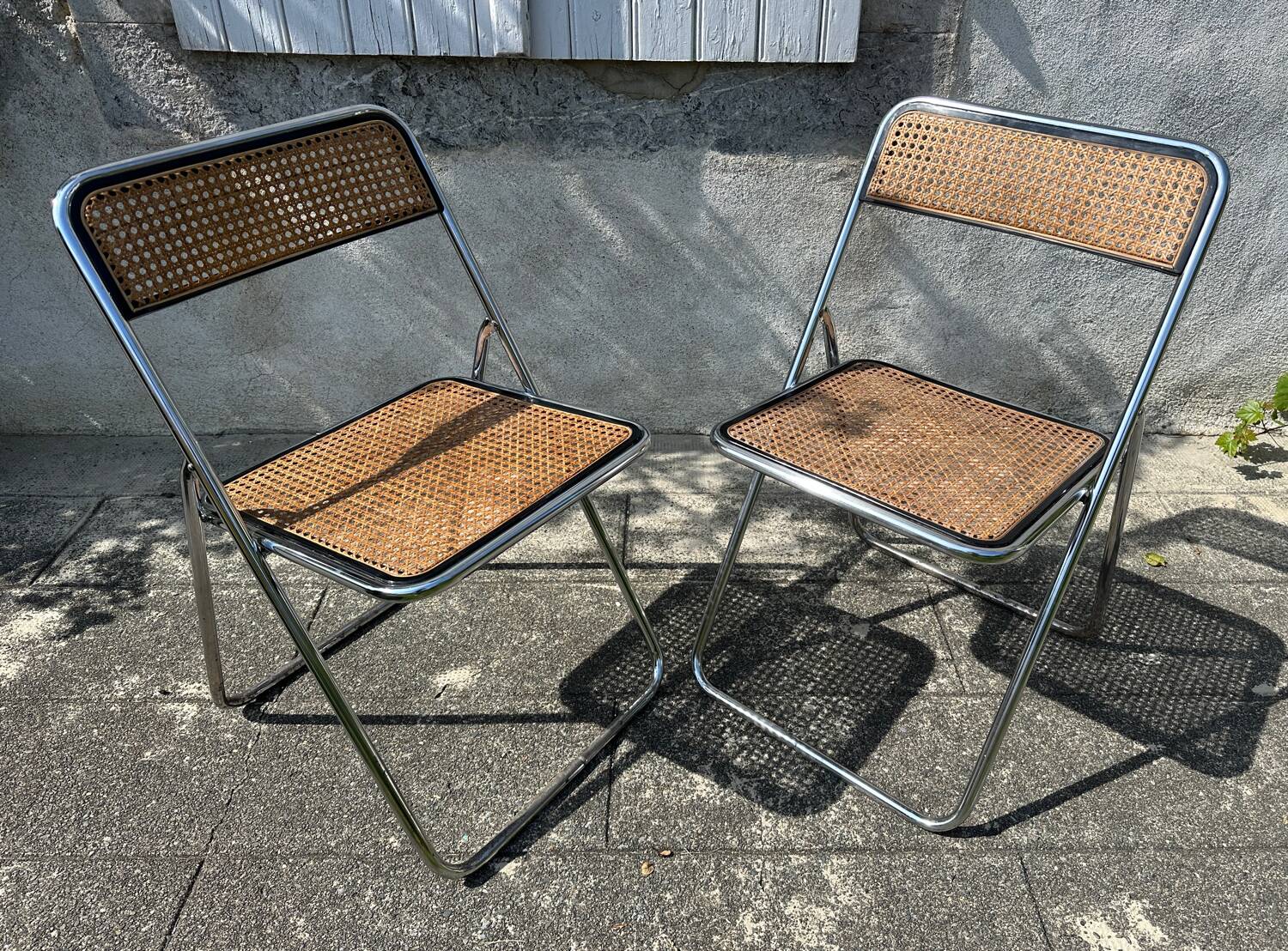 Pair of vintage metal caned folding chairs