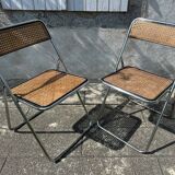 Pair of vintage metal caned folding chairs