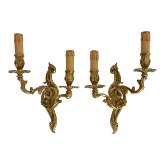 Old pair of wall sconces with double fires in bronze, 50s