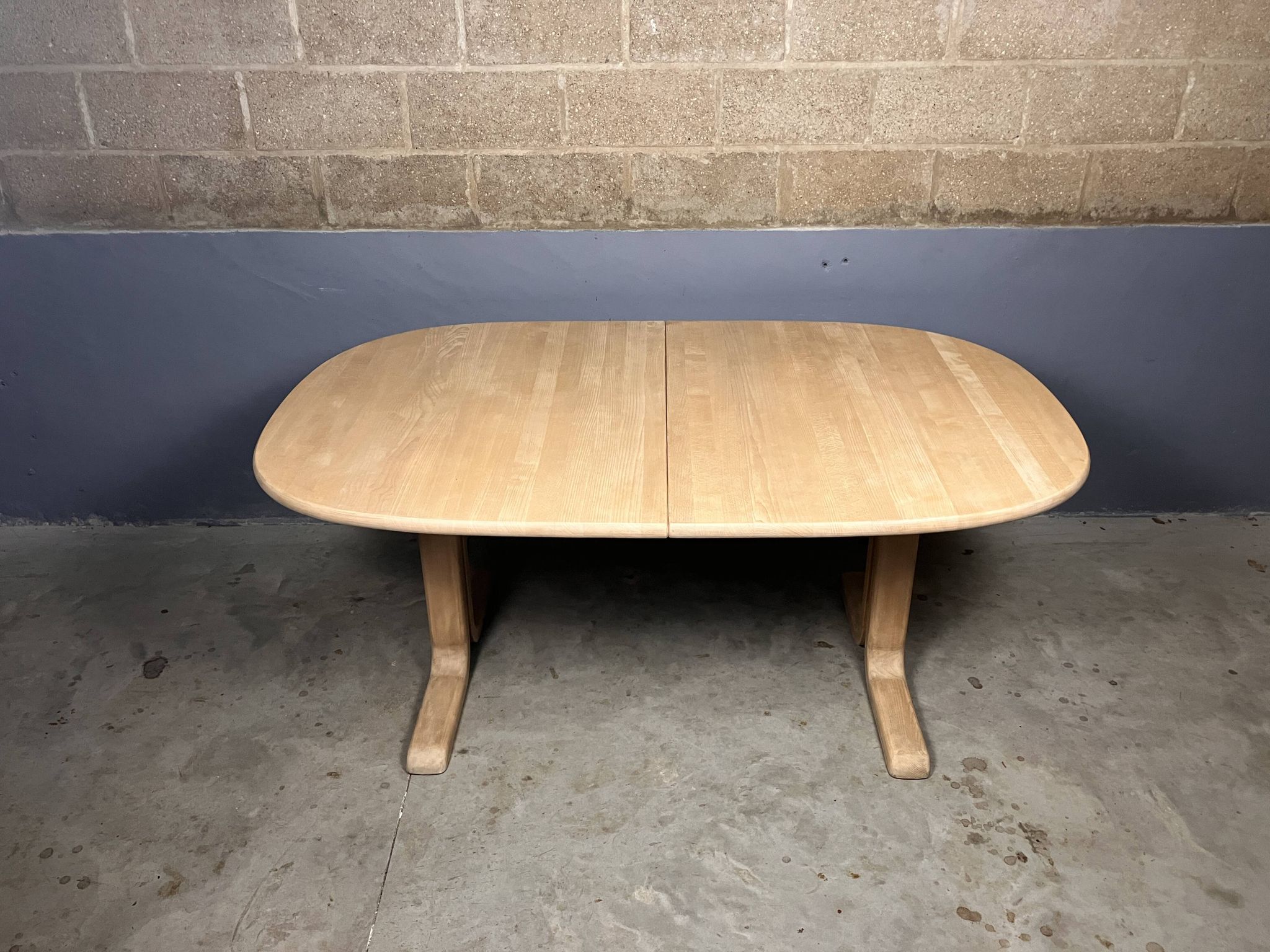 Oval extendable dining table in beech with Danish design.